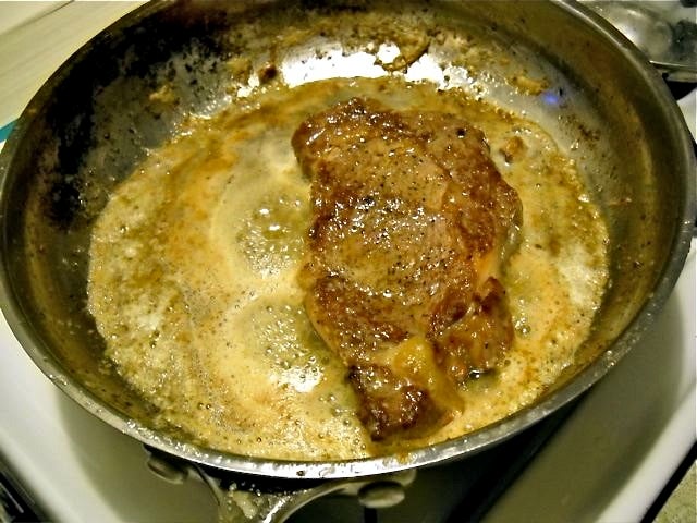 meat cooking in pan