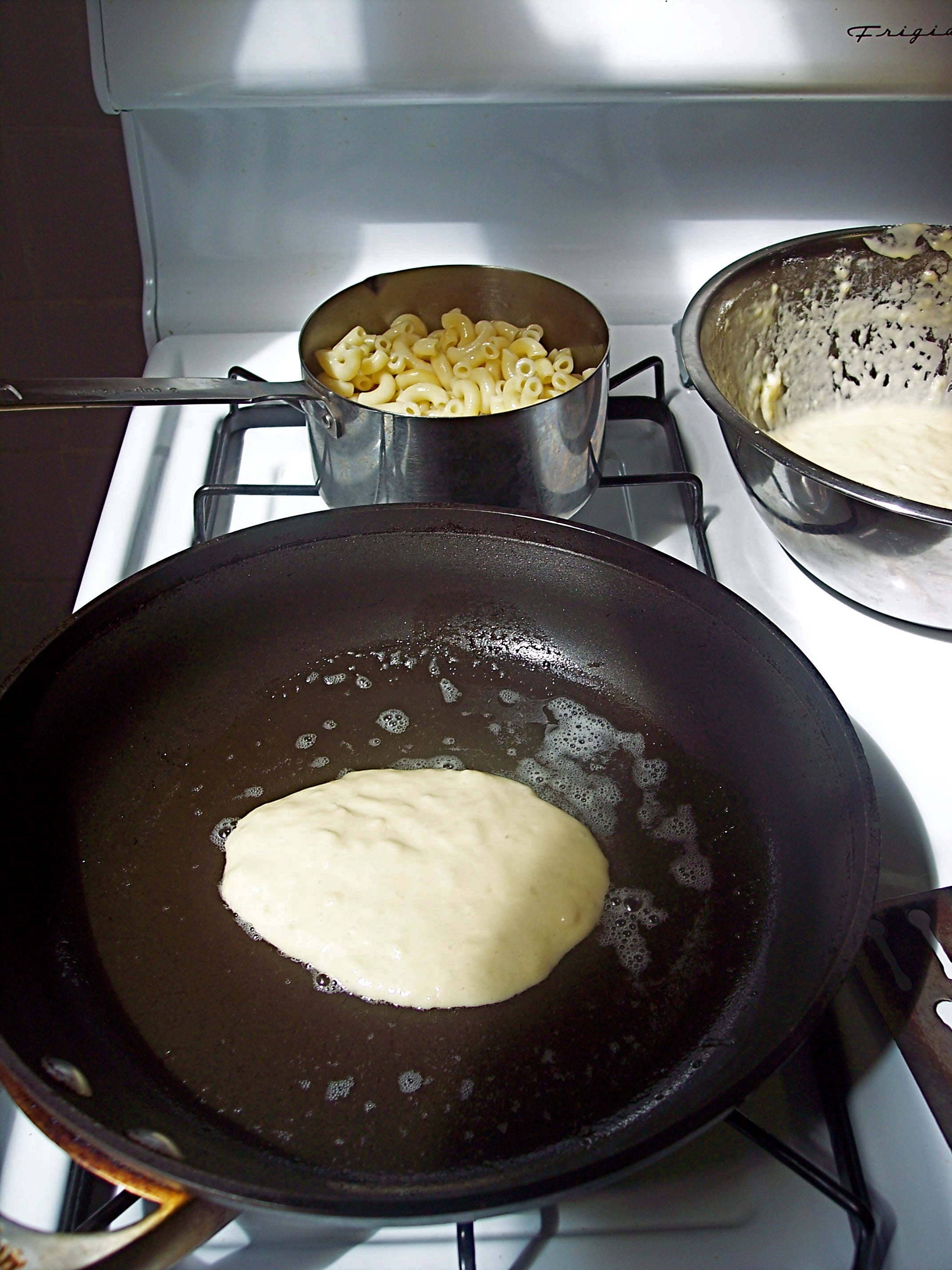 Pancake in pan, with macaroni