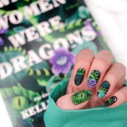 Manicure featuring dragon eye and dragon scales to match book cover